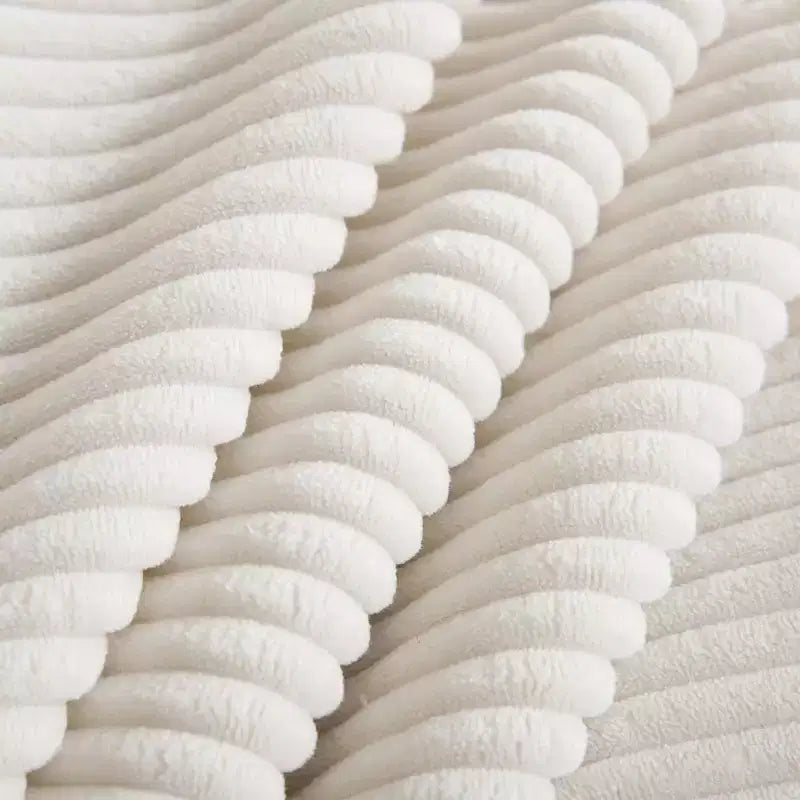 Comodo divano componibile in velluto a coste con cuscini e braccioli arrotondati, moderno divano letto profondo con pouf contenitore