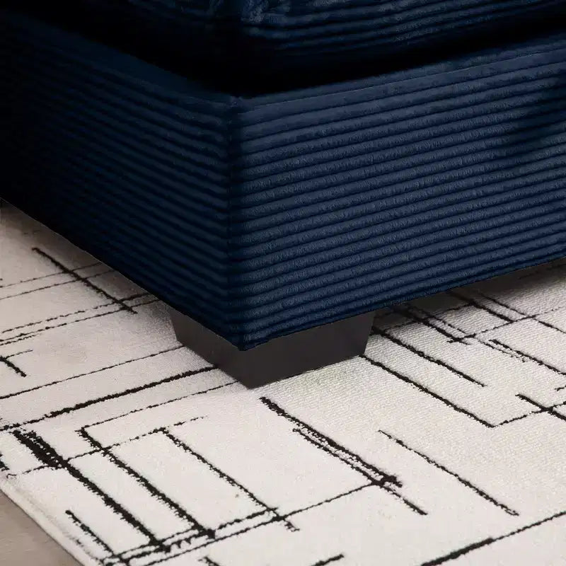 Comodo divano componibile in velluto a coste con cuscini e braccioli arrotondati, moderno divano letto profondo con pouf contenitore